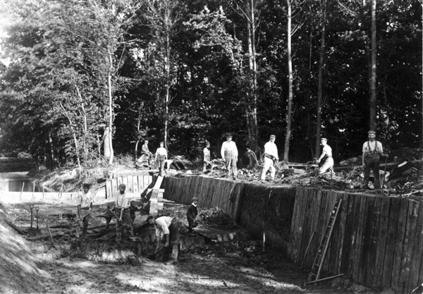 Men at work on dam and walls